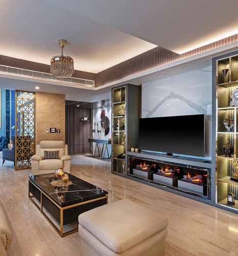 Luxurious living room with marble feature wall, tv unit with fireplace, and gold-accented furniture