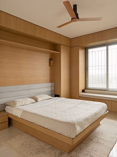 Wood-panelled bedroom with floating bed, upholstered headboard, and window seat under blinds