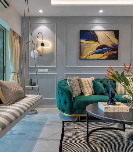Living room with teal tufted sofa, hanging swing bench, and abstract art on grey panelled wall