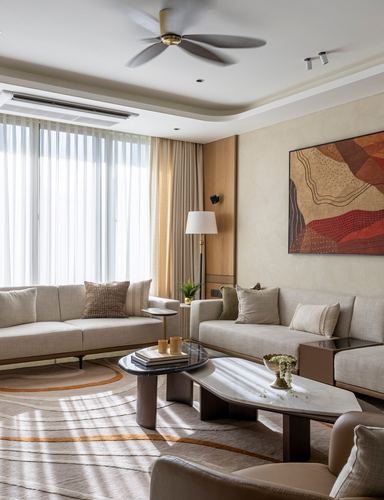 Beige living room with two sofas, layered coffee tables, and a red abstract painting under sheer-curtained windows