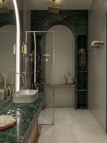 Bathroom with green marble arch, brass fittings, vessel sink and framed mirror on stand