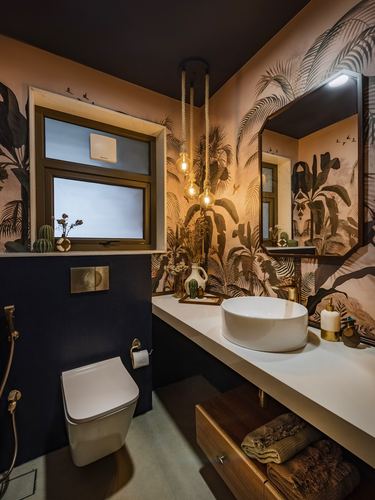Dark tropical-themed bathroom with leaf mural, vessel sink, and hanging pendant bulbs