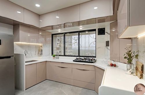 Modern pink and white L-shaped kitchen with corner window overlooking city skyline