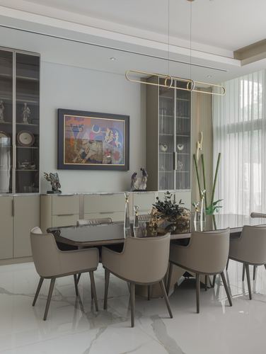 Dining room with marble floor, leather chairs, glass table, and abstract painting above a sideboard