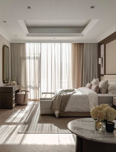 Neutral bedroom with sheer curtained window wall, upholstered bed, and herringbone wood floor lit by soft daylight