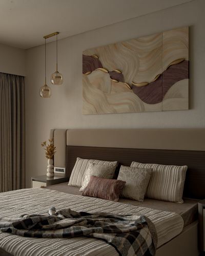 Bedroom with upholstered headboard, layered cushions, plaid throw, and large wavy textured wall art above.