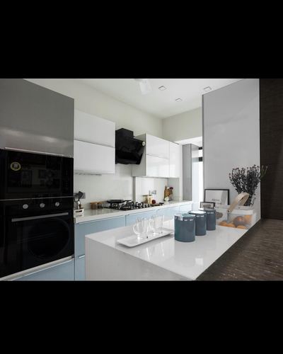 White and pale blue modern kitchen with island counter and built-in oven