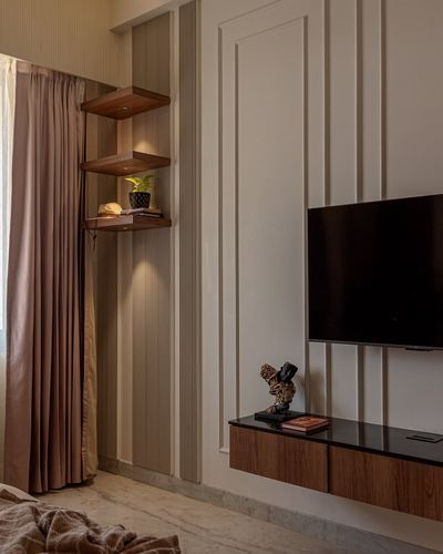 Bedroom wall with floating wooden shelves, fluted panel, wall-mounted TV and dark timber console