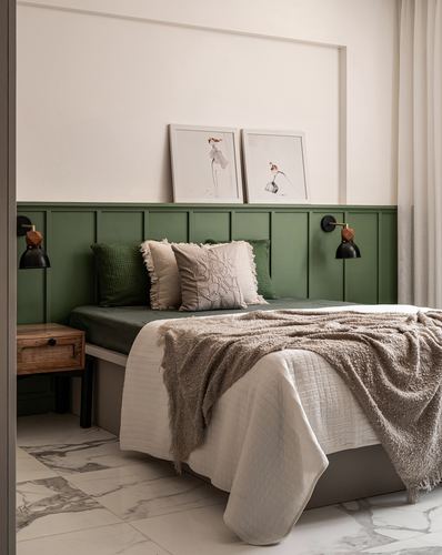 Bedroom with green wainscoting headboard, layered neutral bedding, framed fashion sketches, marble floor