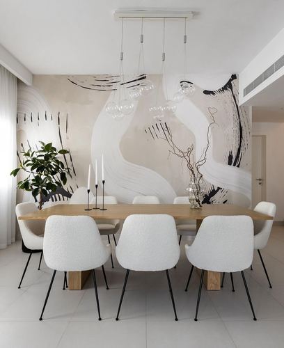 Minimalist dining room with wood table, boucle chairs, bubble pendant lights and abstract mural wall