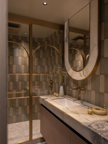 Bathroom with veined marble vanity, brass-framed arched mirror, and checkered green tile shower