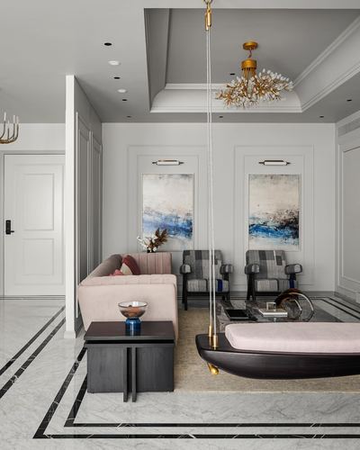 Neoclassical living room with marble floor, brass chandelier, and a hanging boat-shaped swing bench
