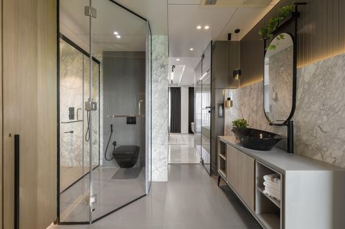 Long marble and wood bathroom with glass shower, black vessel sink and oval mirror