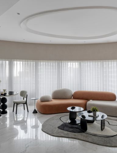 Curved living room with terracotta sculptural sofa, sheer curtains, and organic black coffee tables on marble floor