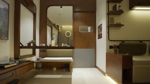 Wood-paneled foyer with arched mirror, built-in bench, and glimpse into a lit inner room