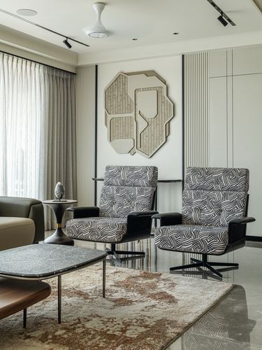 Two zebra-print swivel armchairs before a geometric wall sculpture in a neutral living room