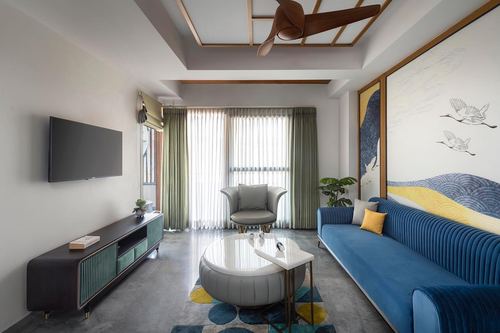 Living room with blue ribbed sofa, crane-print wall panel, and wood-slat ceiling detail