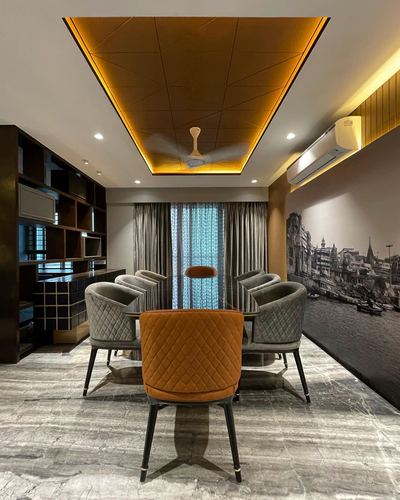 Dining room with grey and orange quilted chairs under an angled orange ceiling coffer, city mural on side wall