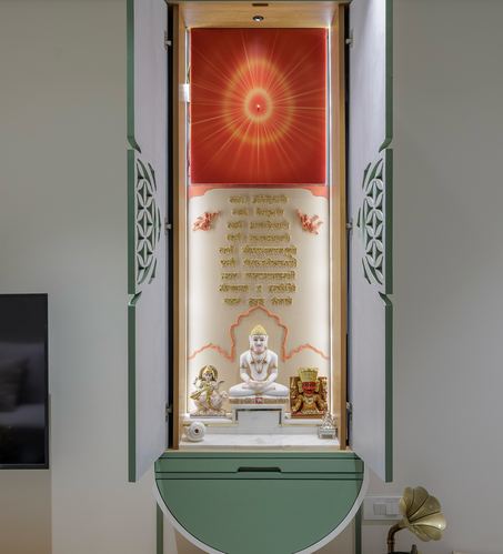 Green lacquered pooja unit with backlit shrine, jali doors, and marble idol platform