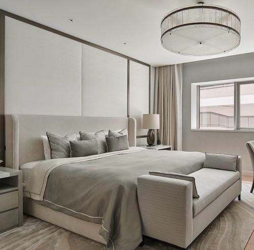 Neutral-toned bedroom with upholstered headboard, drum chandelier, and bench at foot of bed