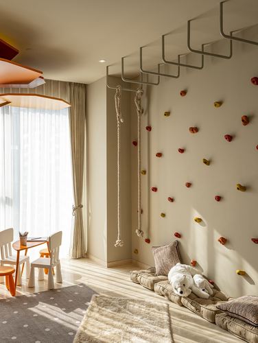 Child's bedroom with climbing wall, rope, monkey bars, and sunlit play corner