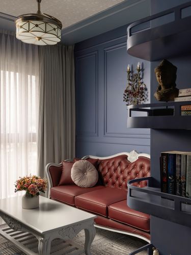 Blue paneled living room with tufted burgundy leather sofa and curved corner bookshelf, Bangalore apartment