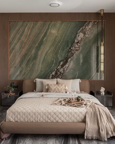 Bedroom with tan leather bed, ribbed wood wall, and large green stone-patterned artwork above headboard