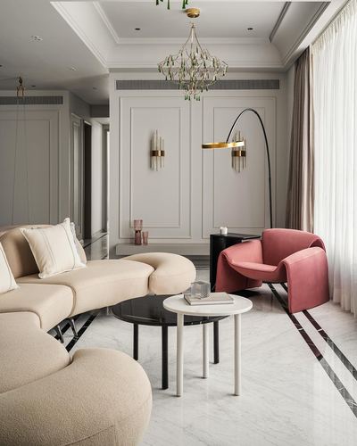 Neoclassical living room with boucle sofa, pink velvet armchair, chandelier, and marble flooring