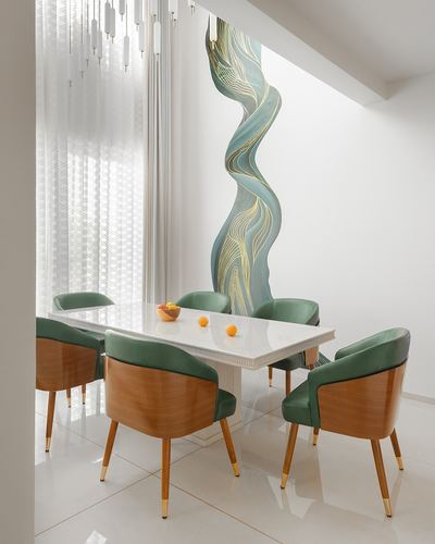 Dining table with green bentwood chairs beneath a wavy teal wall mural and sheer curtains