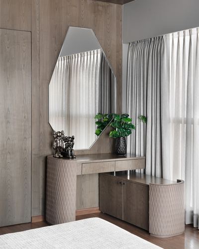 Corner dressing table with octagonal mirror against wood-panelled wall and sheer curtains, Mumbai apartment