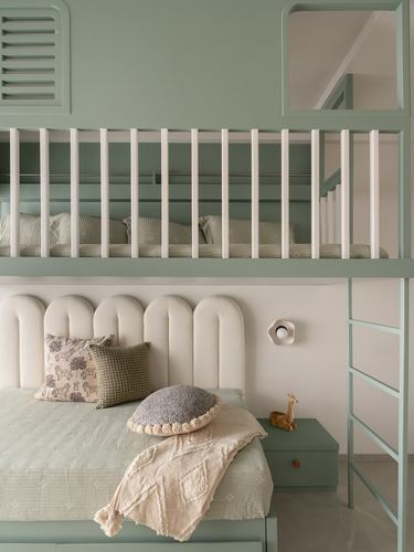 Sage green kids bedroom with scalloped cream headboard and loft bunk bed above