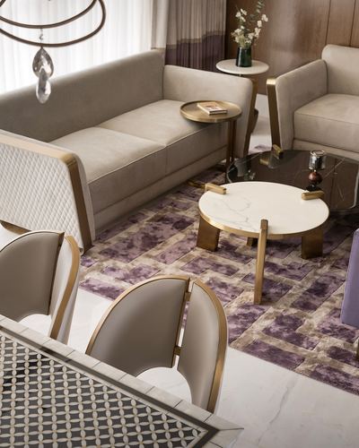 Living room with taupe sofas, brass-legged marble coffee tables, and a mauve patterned rug