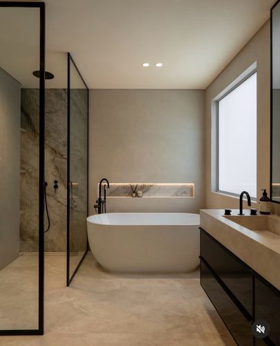 Modern bathroom with freestanding tub, marble shower wall, and floating dark vanity
