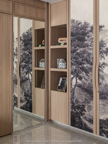 Wood wardrobe with mirrored door and open shelf niche against forest mural wallpaper