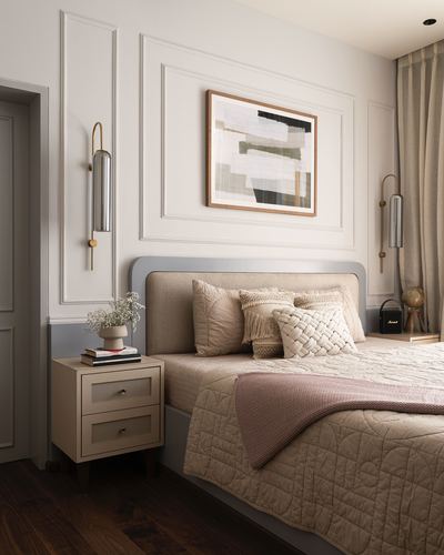 Neutral bedroom with panelled wall, upholstered headboard, abstract art, and brass sconces