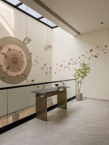 Landing with skylight, terracotta leaf wall art, brass console table and glass railing