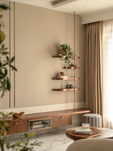 Floating wood shelves with plants beside a curtained window above a wood console