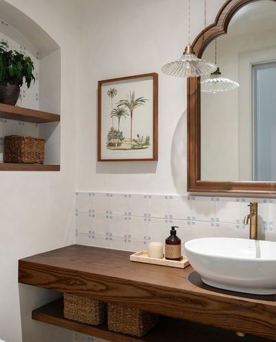 Bathroom vanity with wood counter, arched mirror, glass pendants, and patterned tile backsplash