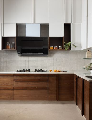 L-shaped kitchen with white upper cabinets, walnut lower cabinets, ribbed tile backsplash and chimney hood