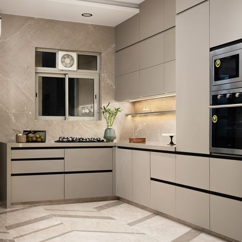 L-shaped taupe modular kitchen with stone backsplash, built-in oven, and geometric floor tile