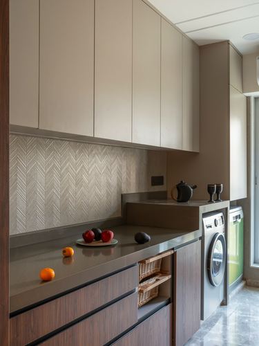 Kitchen counter with fruit, chevron tile backsplash, wood drawers and integrated washing machine