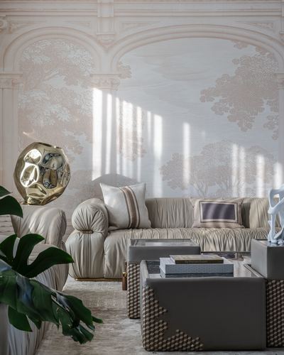 Beige leather sectional sofa before mural wallpaper of arches, with gold faceted sculpture and textured ottomans