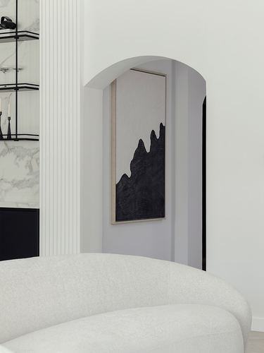 Arched niche with abstract black artwork above curved boucle sofa in monochrome room