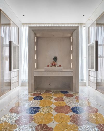 Marble pooja alcove with backlit niche and colorful floral inlay marble flooring