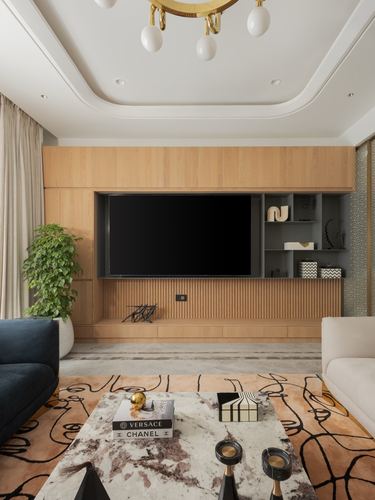 Living room with wood-panelled TV wall, brass chandelier, and patterned marble coffee table on abstract rug