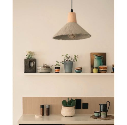 Kitchen vignette with pendant light, ceramic-filled floating shelf, and ribbed tile backsplash