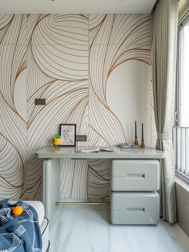 Study nook with swirl-patterned wallpaper, glossy grey desk and drawers, window with sheer curtain