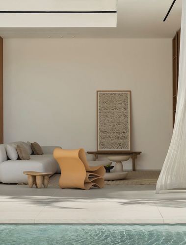 Minimalist living room with sculptural orange chair, neutral sofa, and textured art panel beside a pool