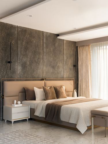 Bedroom with textured stone accent wall, tan leather headboard, and layered neutral bedding