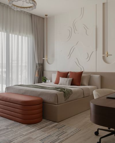 Neutral bedroom with terracotta ottoman, sculptural plaster wall panel, and soft pendant lighting